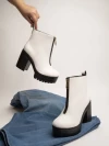 Stylestry Womens & Girls White Solid Zipper Heeled Boots